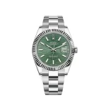 Rolex Datejust 126334 2023 in stainless steel with a 41mm case, green dial, fluted bezel, and stainless steel Oyster bracelet, complete with box and papers.
