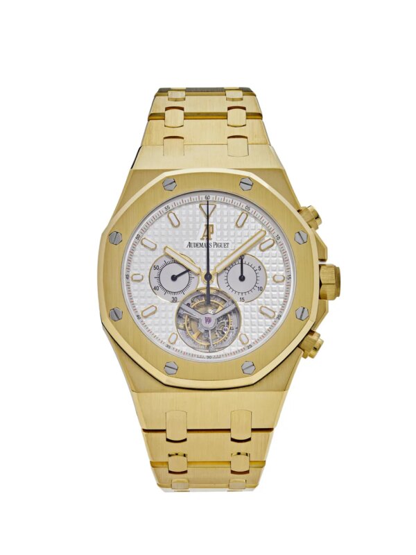 Audemars Piguet Royal Oak 25977BA.OO.1205BA.01 Chronograph Tourbillon in 18k yellow gold with a 44mm case, silver Tapisserie dial, and gold bracelet with folding clasp.