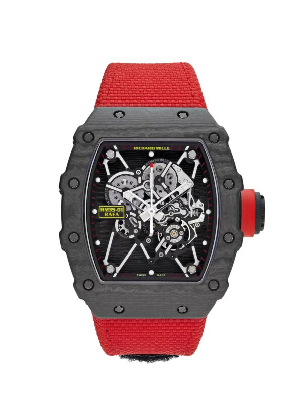 Richard Mille RM 35-01 Rafael Nadal in black NTPT carbon with skeletonized dial, red accents, black textile strap, and titanium deployant buckle.