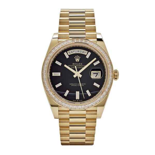 Rolex Day-Date 228398TBR yellow gold watch with onyx dial, baguette diamond hour markers, and diamond-set bezel.